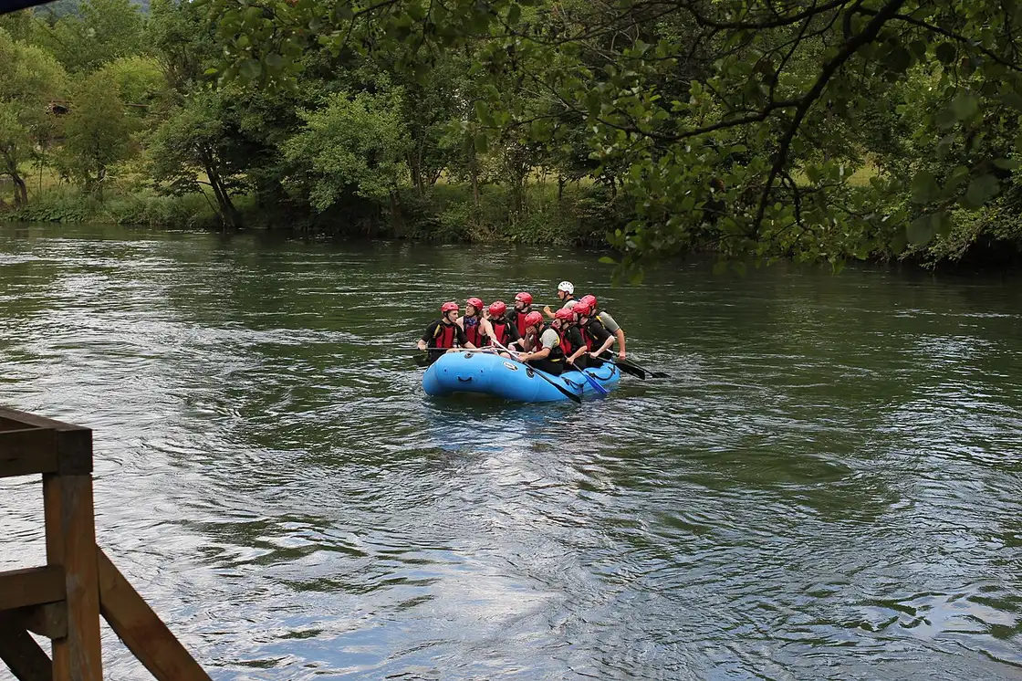 A raft of paddlers running white water on the Vrbas river near Banja Luka