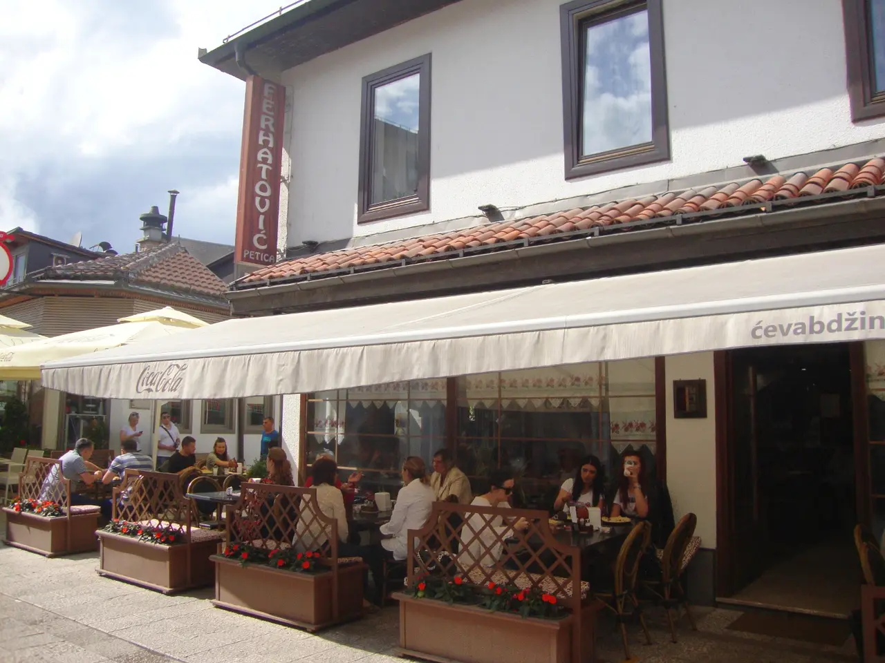 The Ferhatovic Petica sign above the terrace of the cevabdzinica on Bravadziluk street in Sarajevo