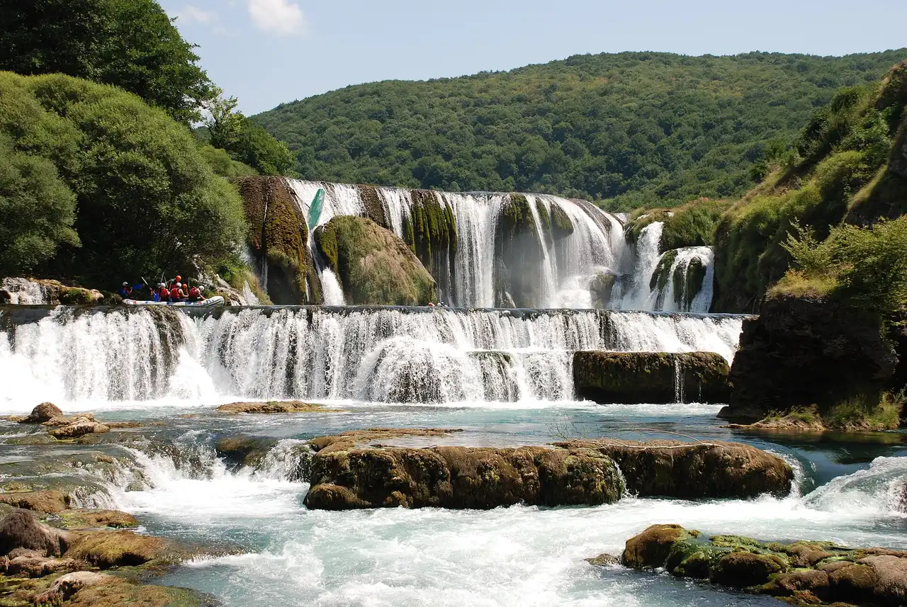 Štrbački buk on the Una river, a wide staircase of turquoise cascades over terraced tufa steps