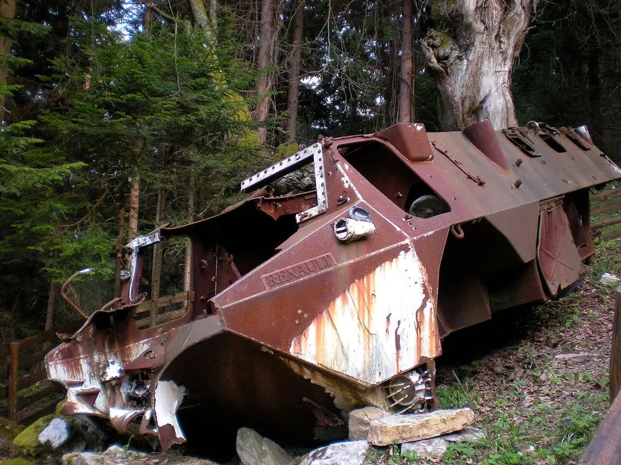 The rusted wreck of the French armoured vehicle from the 1995 Igman road accident, beside the memorial below the Igman road