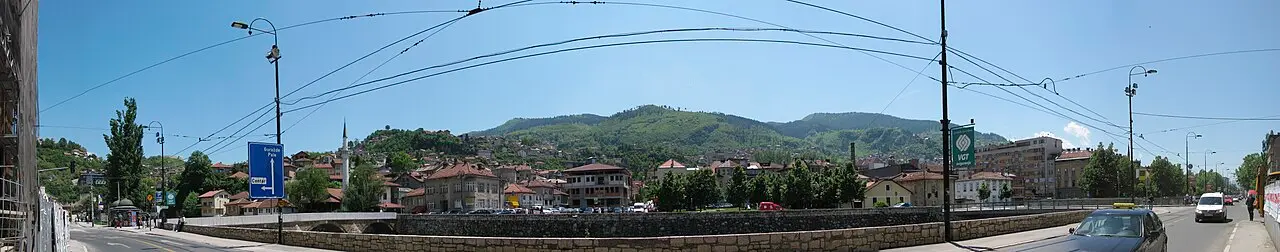 Panoramic view over the rooftops and minarets of Sarajevo in its valley from the Bistrik hillside