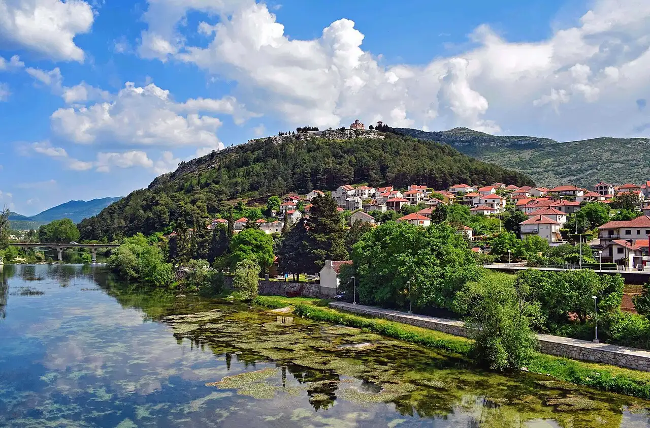 View over Trebinje and the Trebišnjica river valley in southern Herzegovina, with hills and vineyards beyond