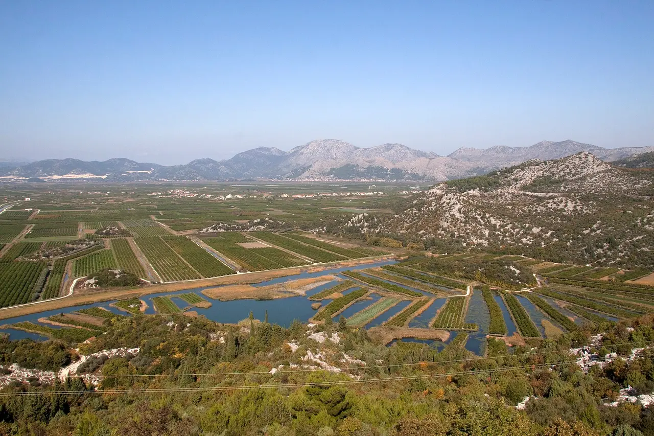 The green fields and channels of the Neretva delta near Metkovic in Croatia, below the inland Doljani crossing into Bosnia