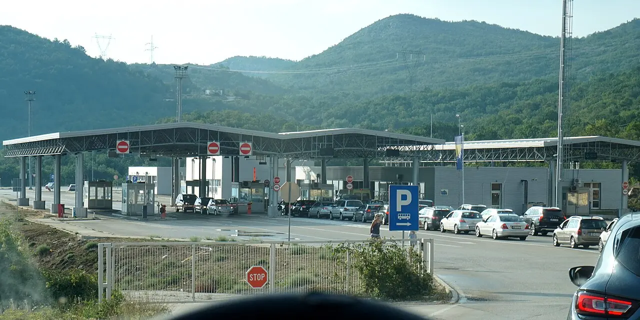 The Klobuk border crossing between Bosnia and Herzegovina and Croatia in Herzegovina, booths beside the open road