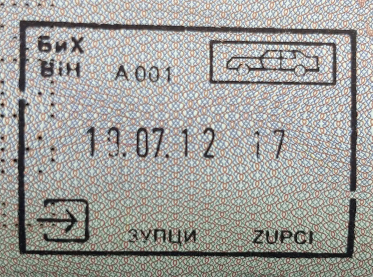 A road border crossing point into Bosnia and Herzegovina near Zupci, with a passport-control booth and signage