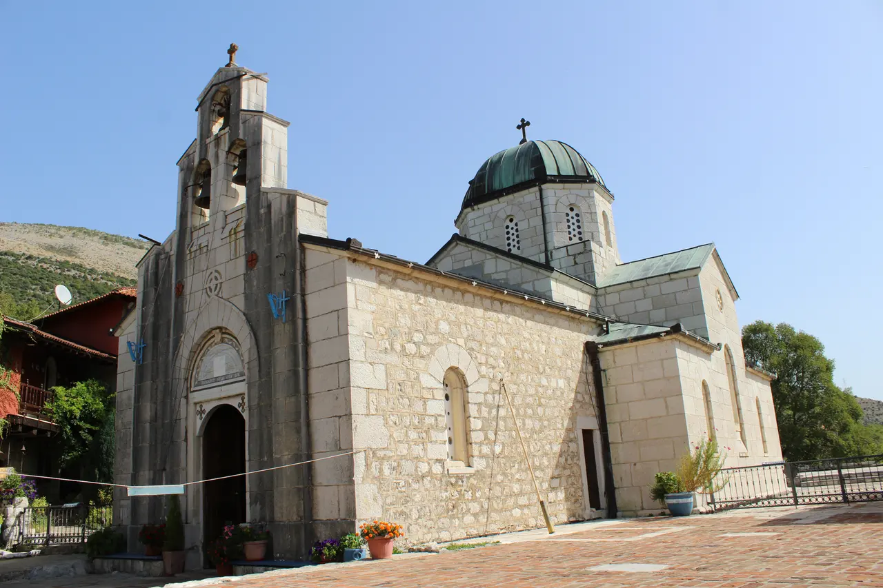 The stone Orthodox church of Tvrdos Monastery near Trebinje under a clear blue sky