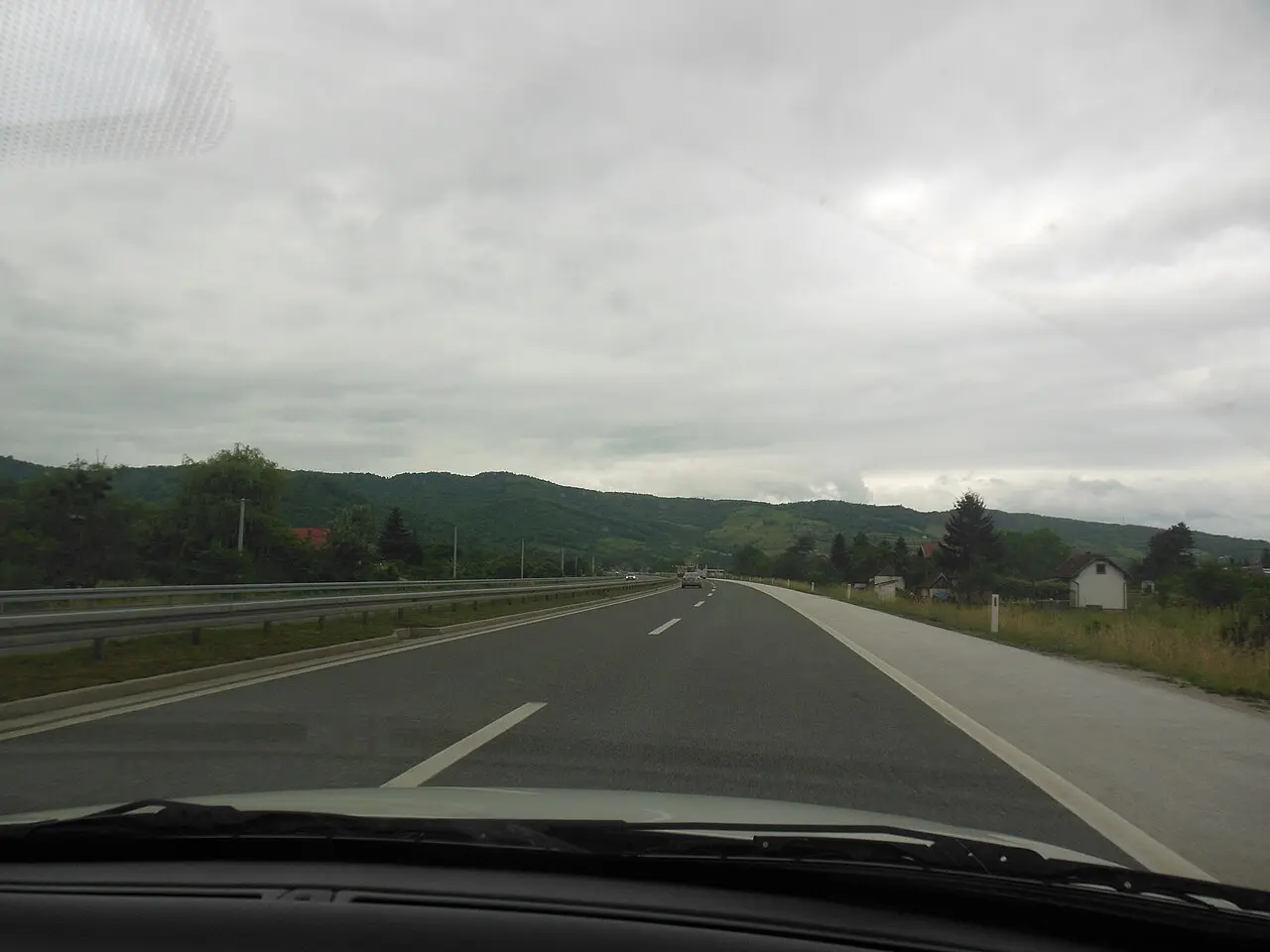 The A1 motorway running through hills near Sarajevo, two carriageways with light traffic