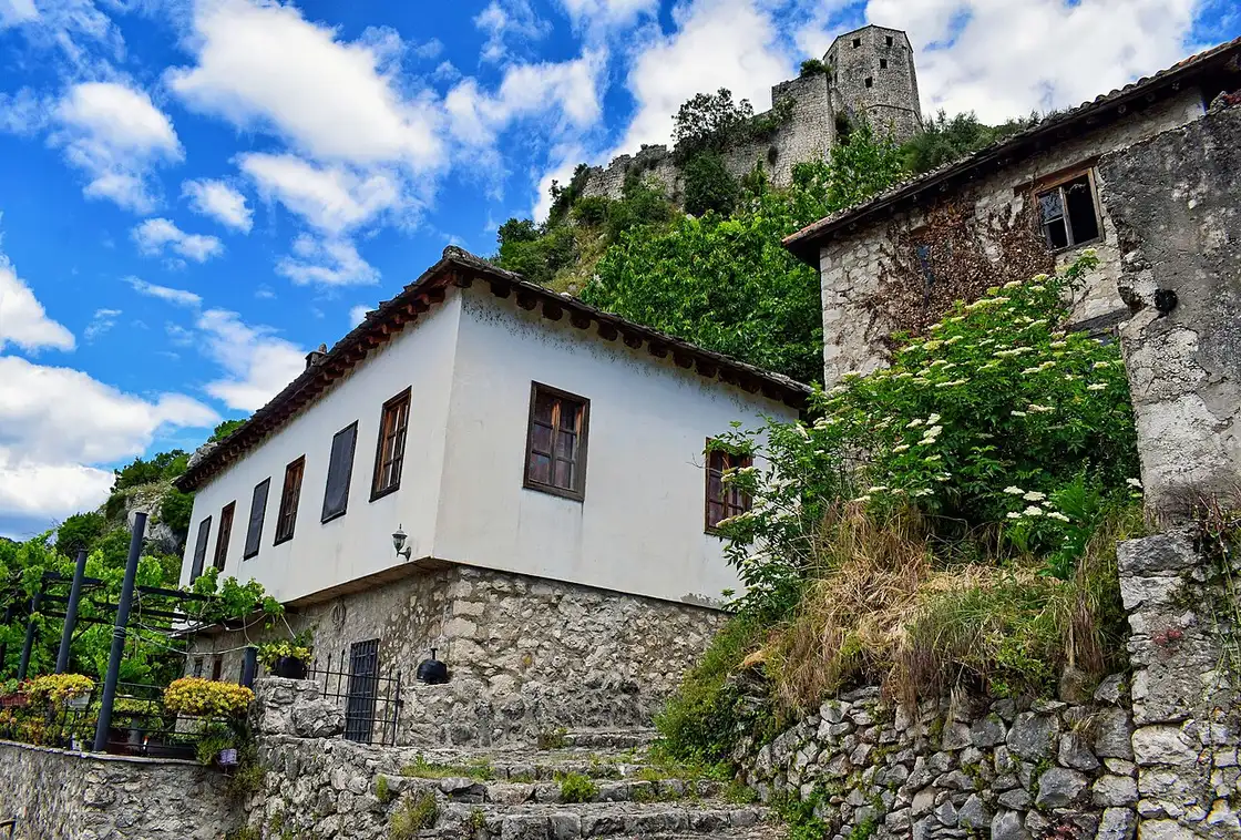 Ottoman stone houses and the hilltop fortress tower of Pocitelj, a walled village and popular stop on the road to Mostar