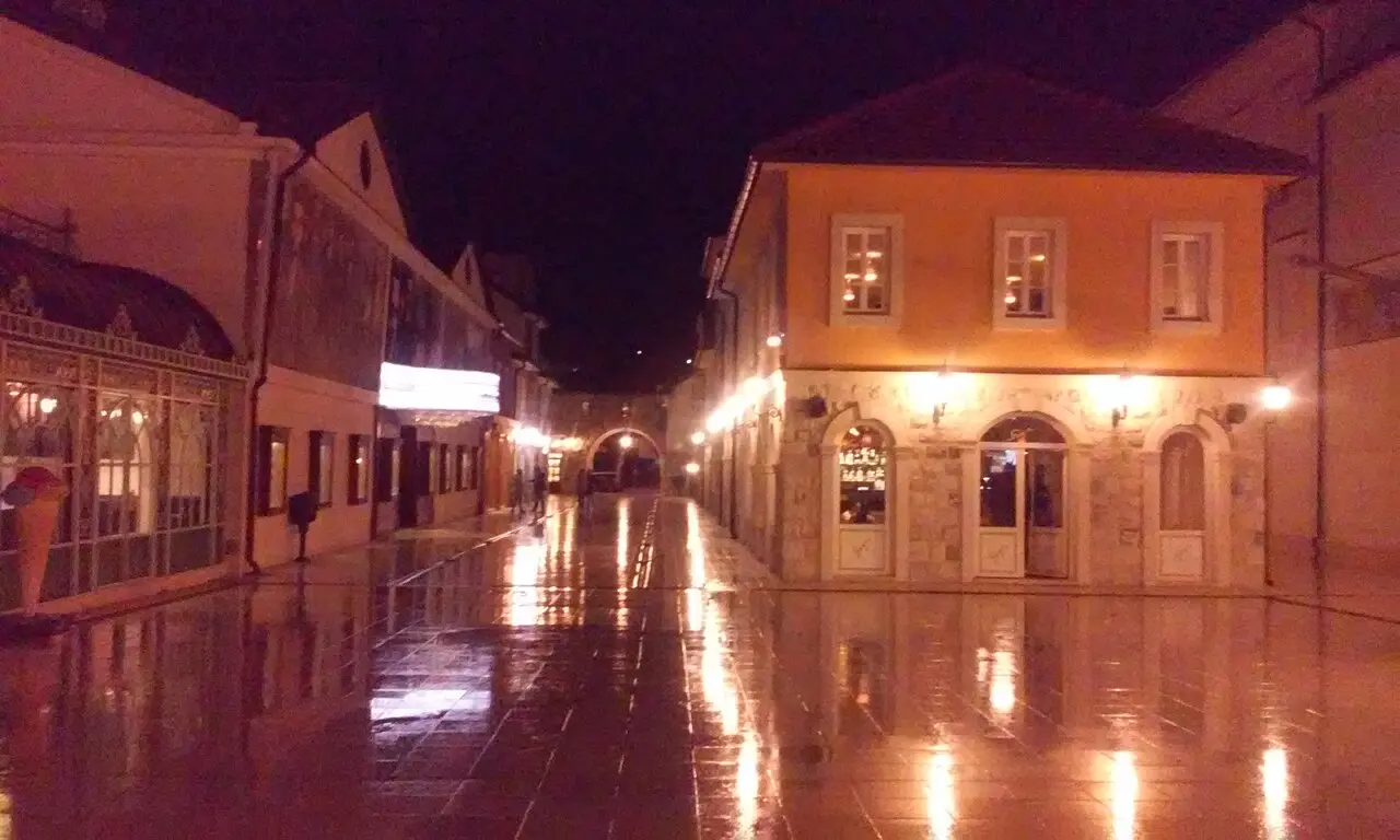 A street of pale stone buildings in Andrićgrad, the Kusturica-built quarter beside the Drina bridge in Višegrad