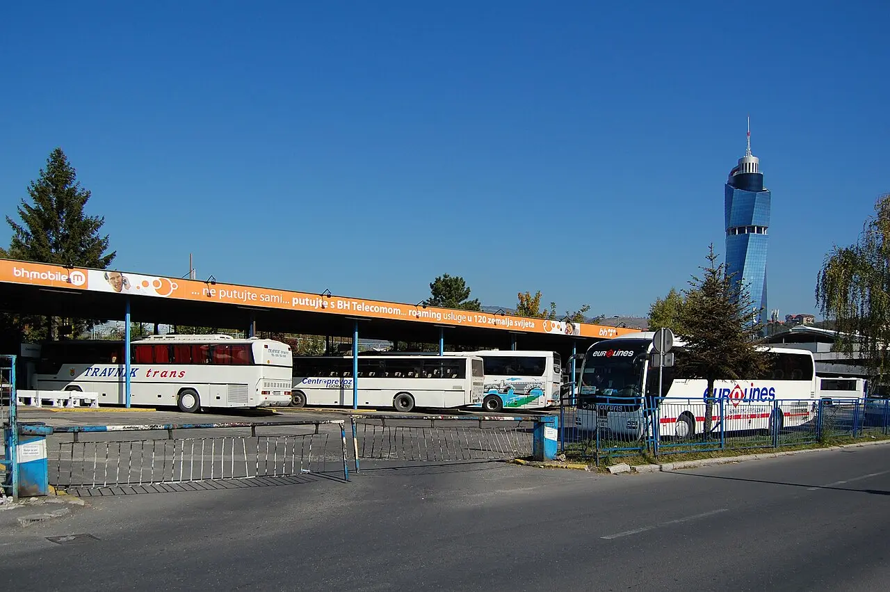 The main bus station in Sarajevo, coaches parked along the platforms on a bright day