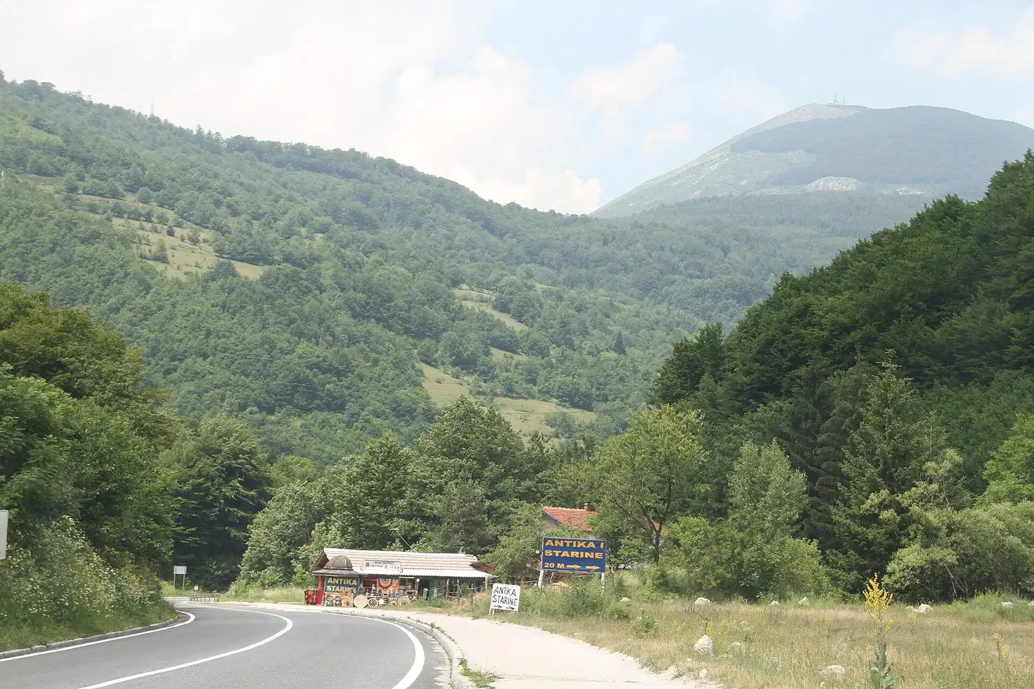 A mountain highway winding through forested slopes between Konjic and Bradina in central Bosnia