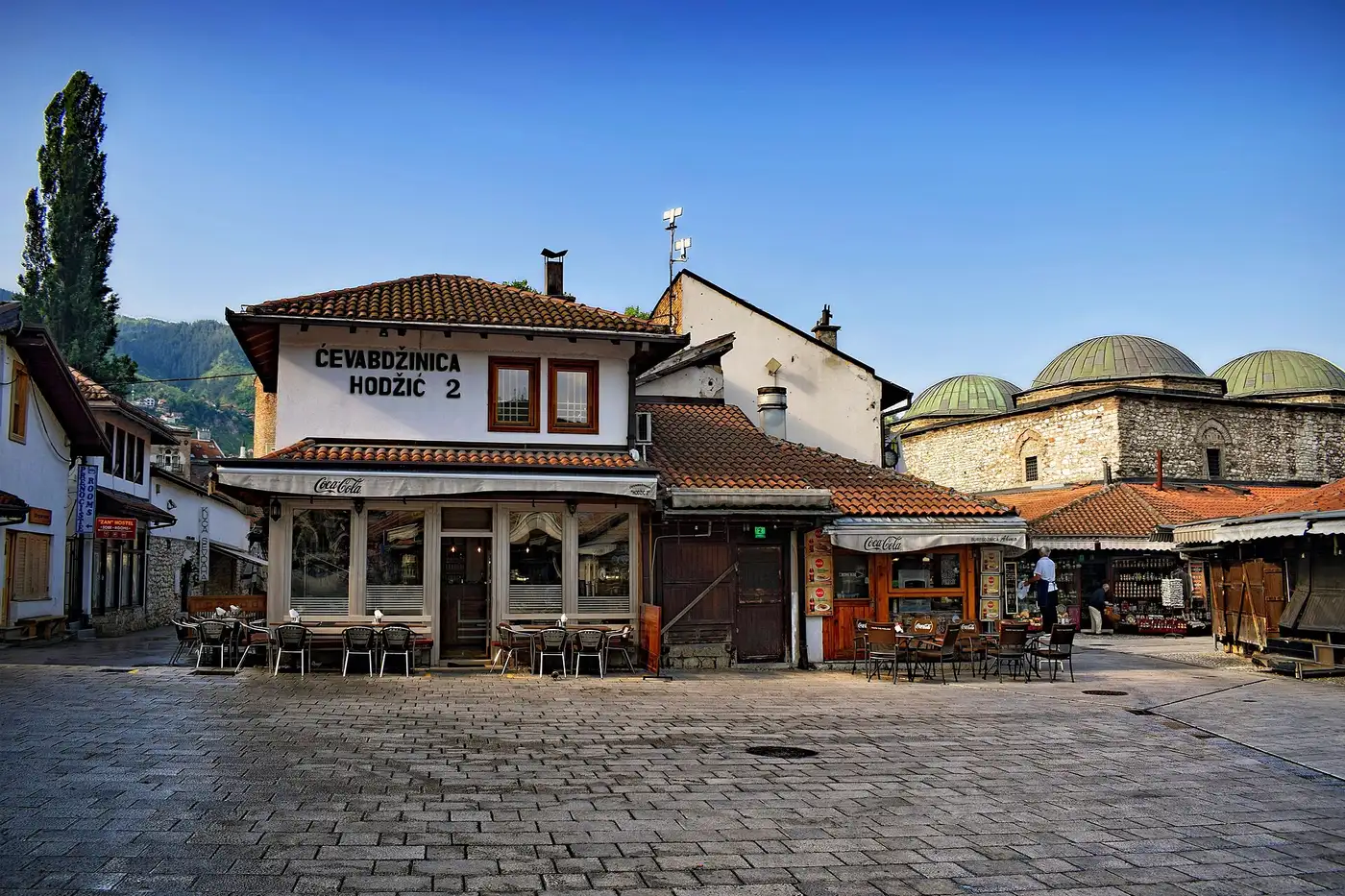 The Ottoman bazaar of Baščaršija in Sarajevo early in the morning, empty cobbled lanes and low wooden shopfronts