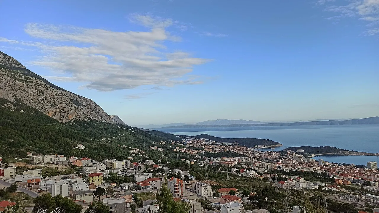 The town of Makarska spread along its bay below the steep grey wall of the Biokovo mountains, the starting point on the Dalmatian coast