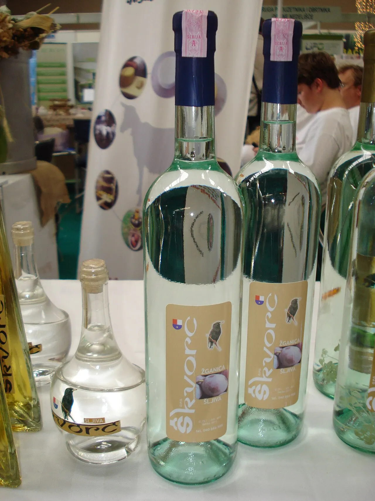 Bottles of Skvorc brand zganica sljivovica, Croatian plum rakija, on display at a food and drink fair