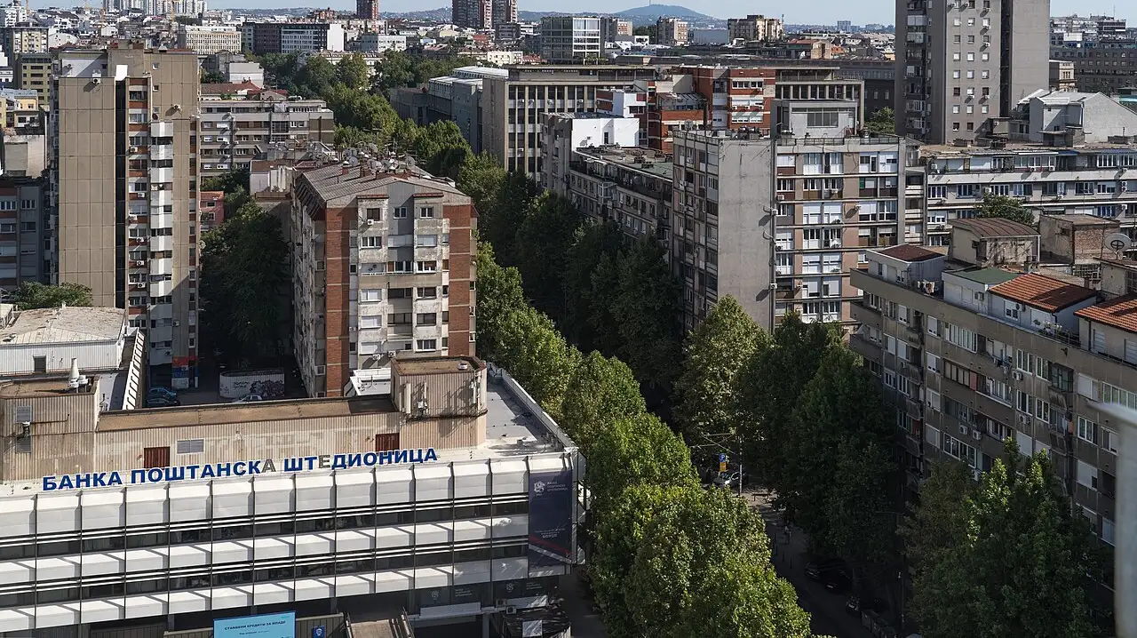 A wide view over the rooftops of Belgrade towards the river on a clear summer day