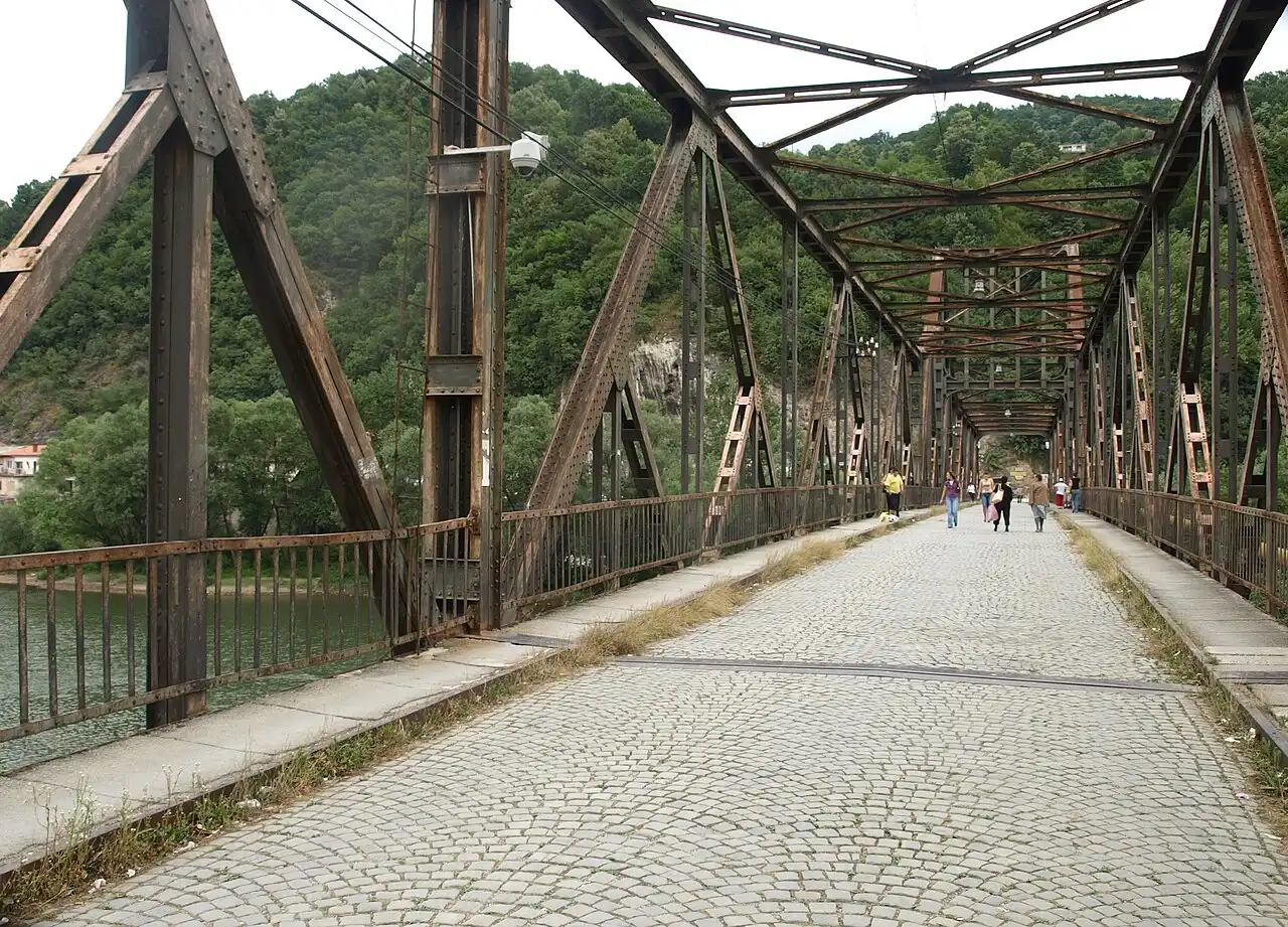 The road border crossing between Bosnia and Serbia at Zvornik on the Drina river, control booths spanning the carriageway