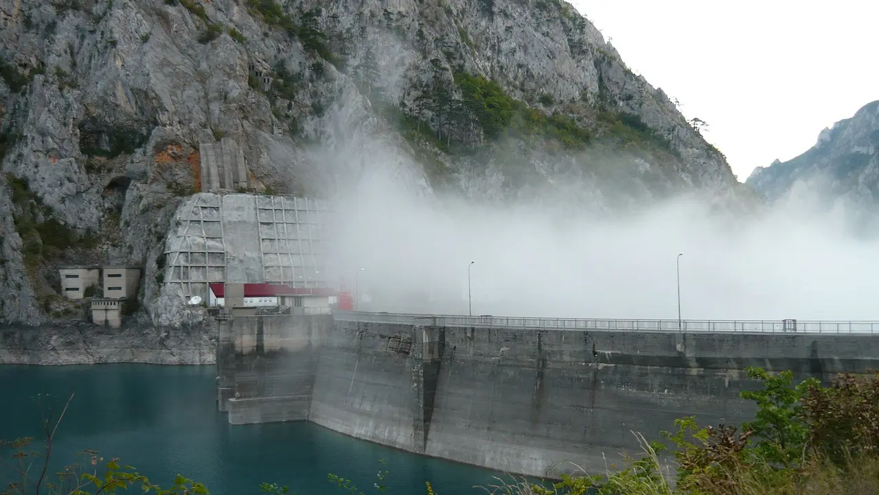 The turquoise Piva reservoir held back by the Mratinje dam in Montenegro, the scenic stretch the Sarajevo to Kotor route threads through