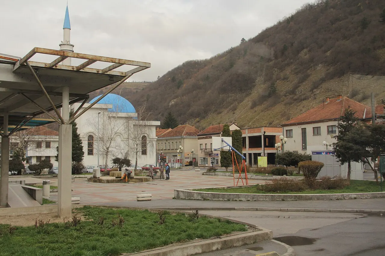 The town square of Donji Vakuf with its mosque and minaret, hills rising behind, on the road between Travnik and Jajce