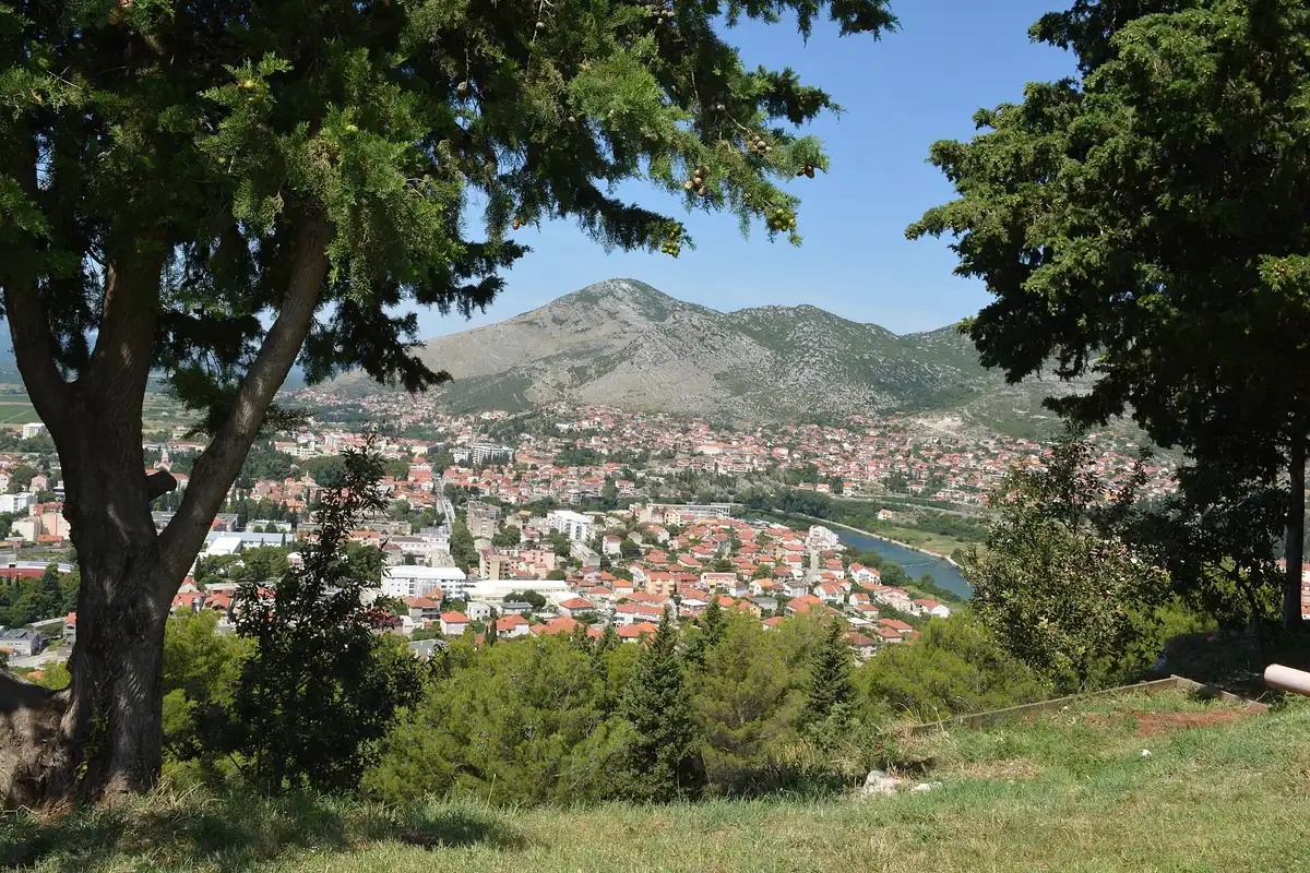 Red roofs of Trebinje spread across the Trebišnjica valley below dry Herzegovinian hills, the destination at the south end of the inland road