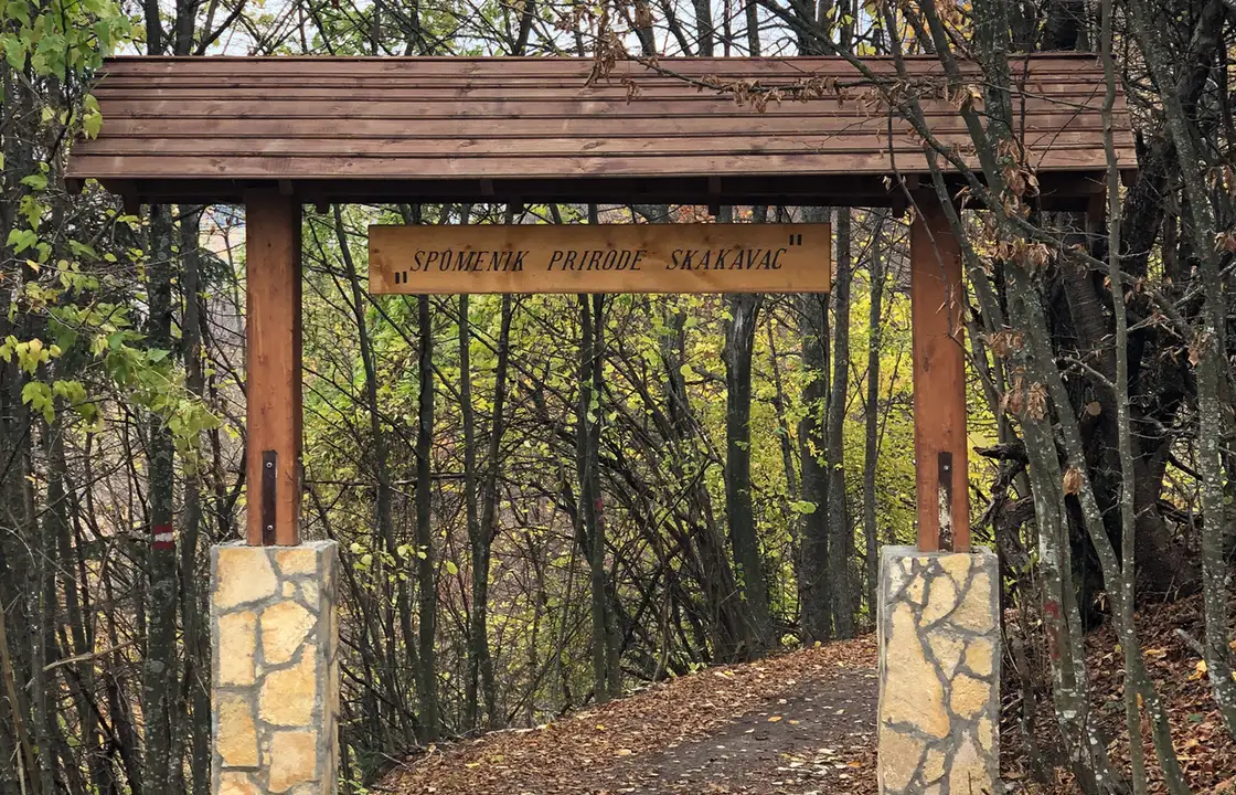 The signed entrance to the Skakavac nature preserve above Nahorevo with forest road beyond