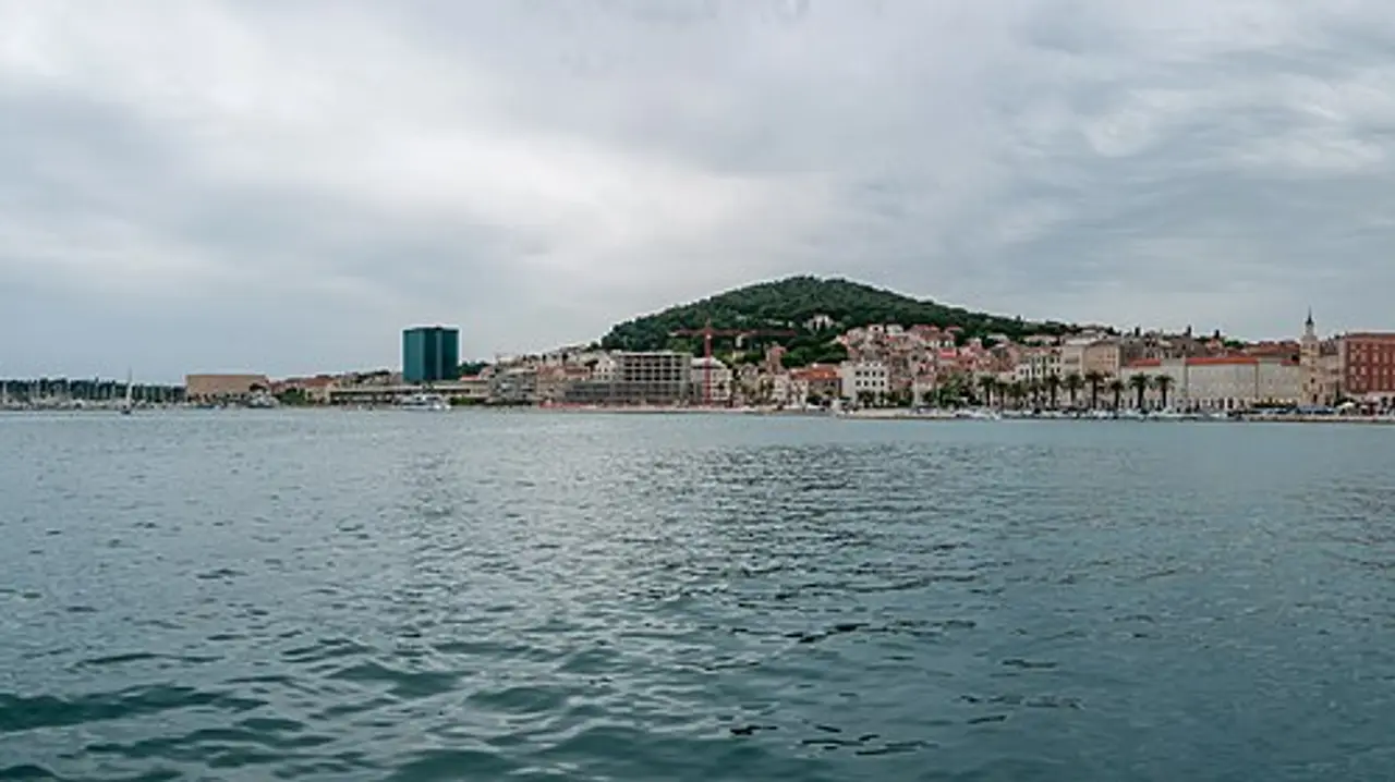 The waterfront of Split across the harbour, palm-lined Riva and the old town below Marjan hill, the starting point of the route to Mostar