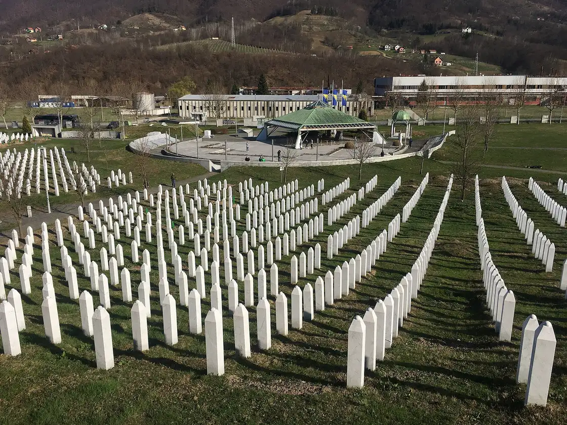 An elevated view over the cemetery and the green-domed memorial prayer pavilion at Potočari