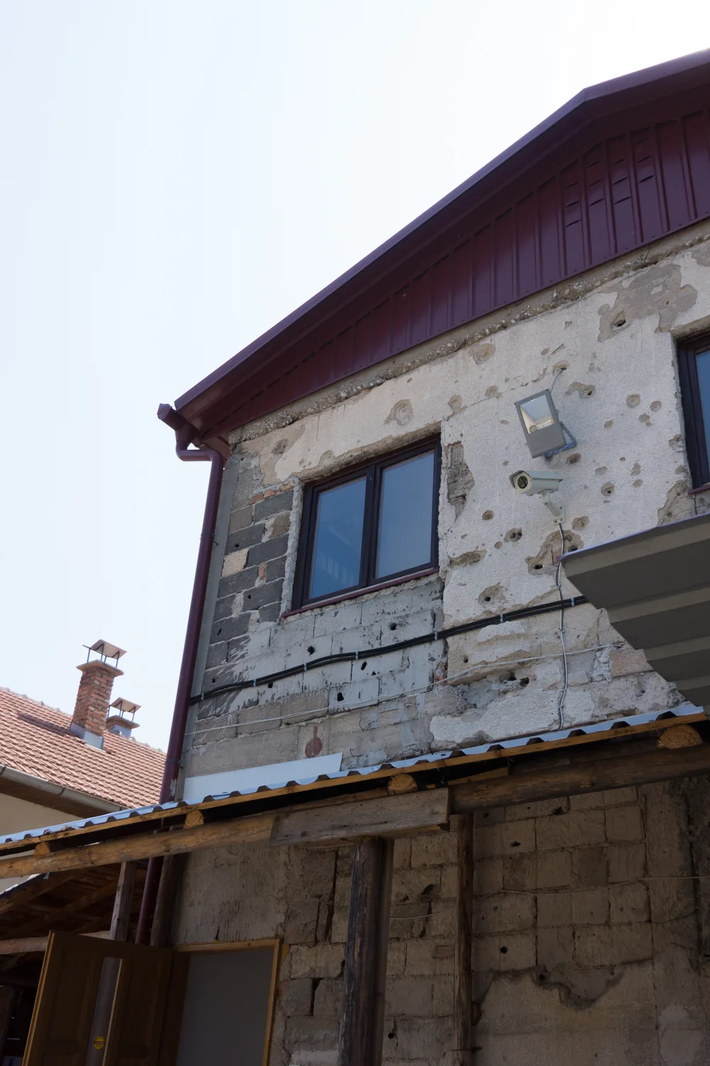 The bullet- and shrapnel-scarred Kolar family house at the Tunnel of Hope museum in Butmir, Sarajevo