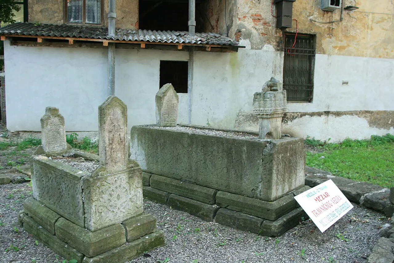 Carved stone Ottoman tombs of a Travnik vizier, with a sign identifying the grave