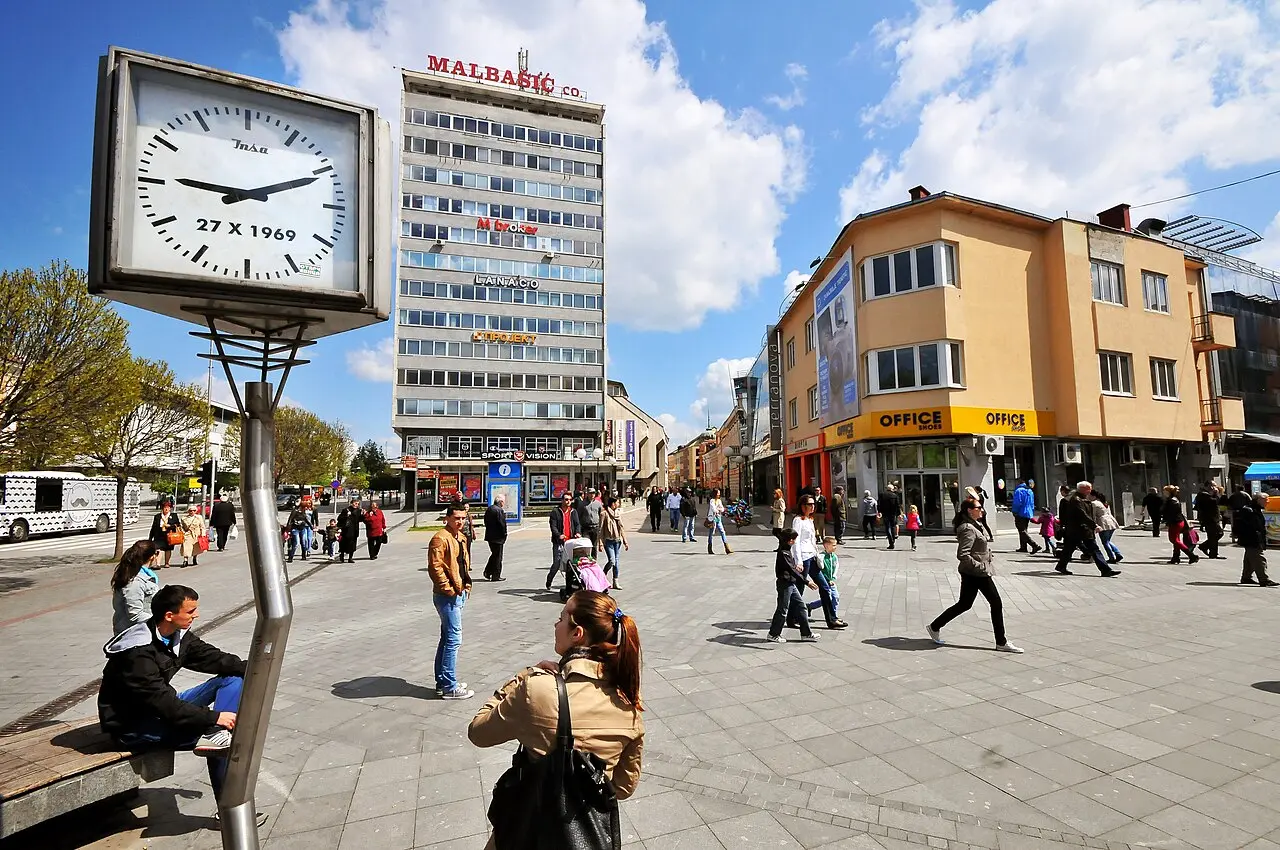 The pedestrian Gospodska street in central Banja Luka with cafés and a clock, people walking
