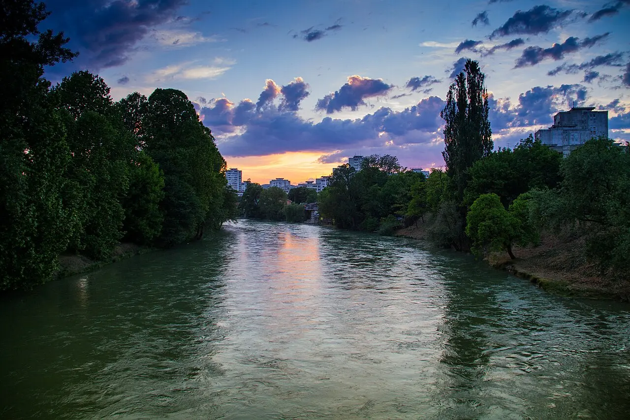 The clear green Vrbas river flowing past wooded banks near Banja Luka