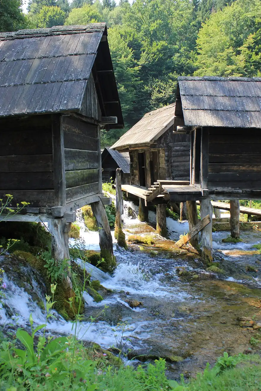 Wooden watermills straddling a channel of the Pliva river between the lakes near Jajce